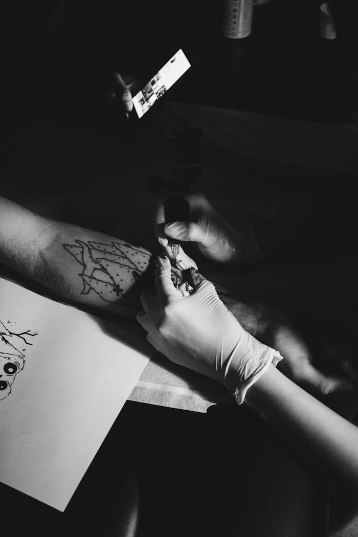 Person Doing Tattoo Session